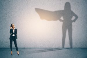 business woman thinking with caped shadow